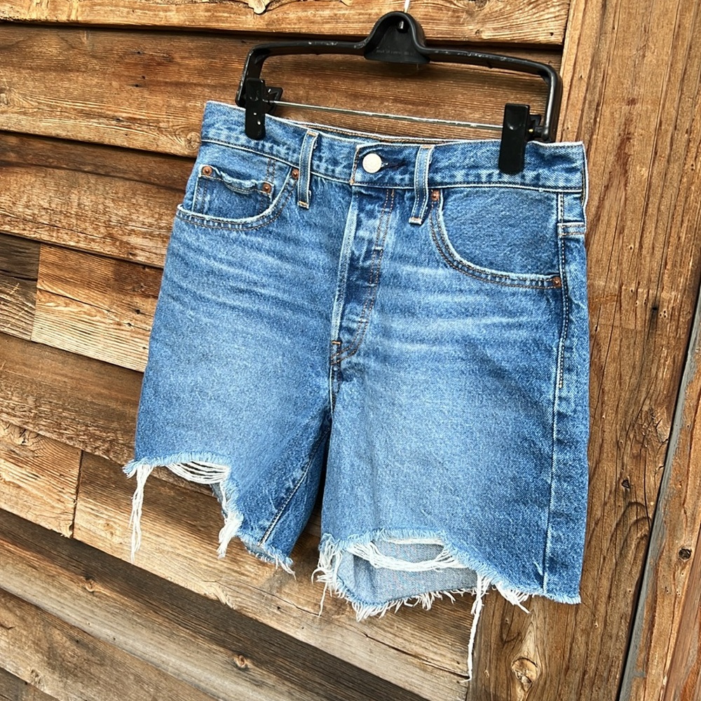 Levi’s 501 distressed Raw hem button fly cutoff jeans